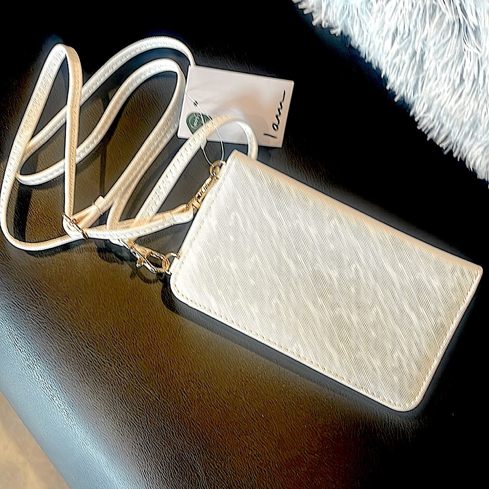 Women’s white clutch with built in phone holder